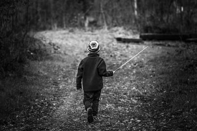Full length of boy walking on street