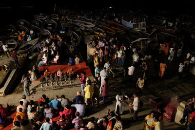 High angle view of people on street at night