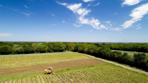 Aerial view of combine harvester on agricultural field