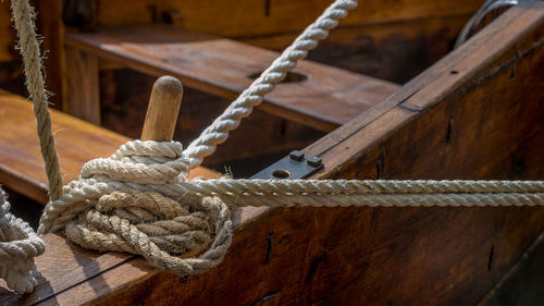 Close-up of rope tied on wooden boat