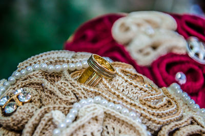 Close-up of wedding rings on fabric