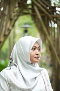 Portrait of young woman looking away