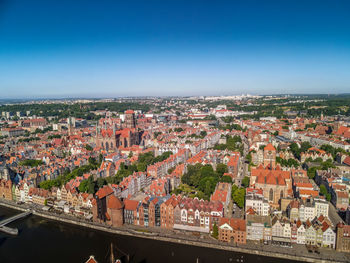 High angle view of townscape against clear blue sky