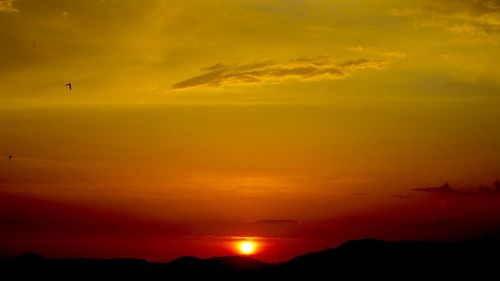 Silhouetted mountains during sunset