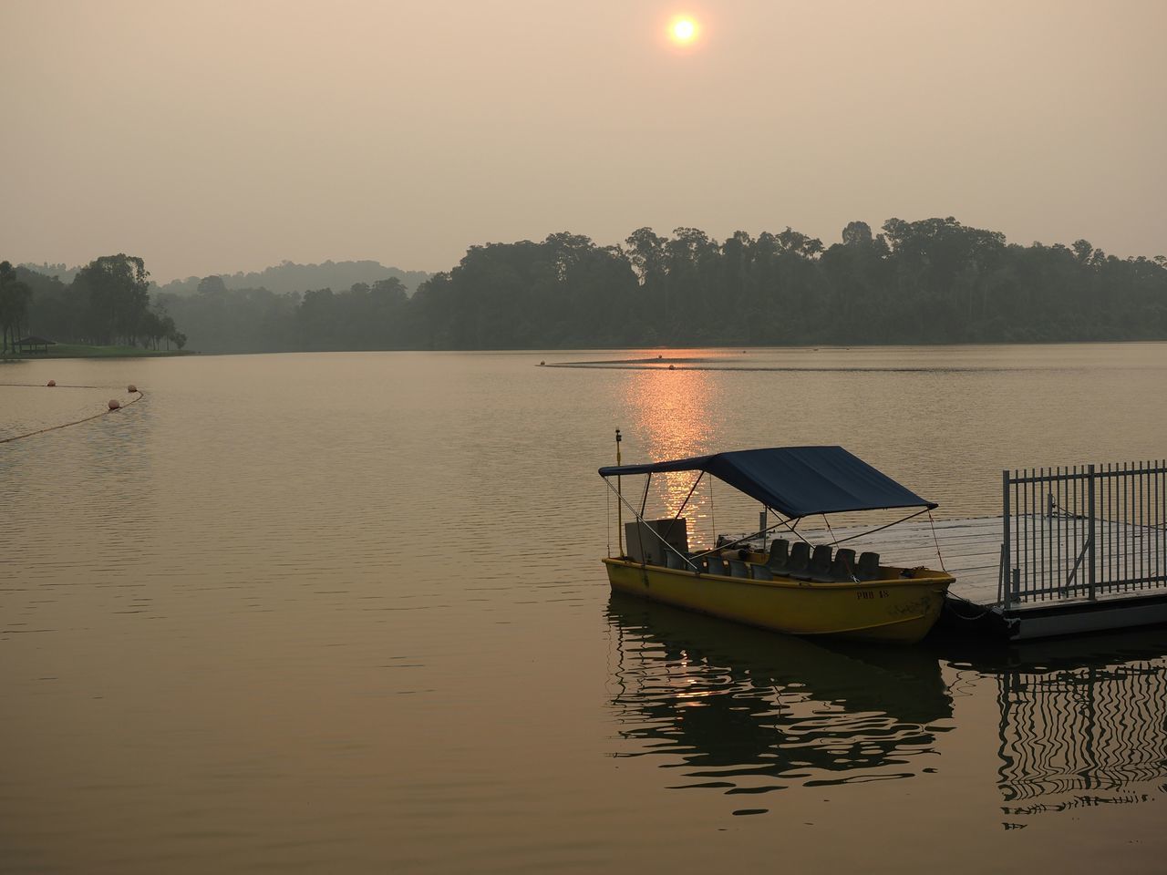 water, nautical vessel, sunset, transportation, boat, tranquil scene, tranquility, mode of transport, scenics, reflection, beauty in nature, moored, lake, nature, sea, sky, clear sky, waterfront, tree, silhouette