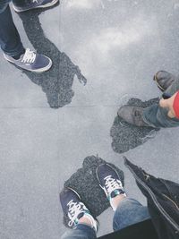 Low section of woman standing on tiled floor