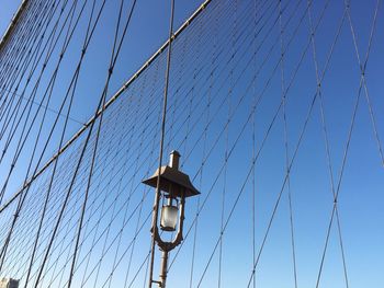 Low angle view of street light against sky