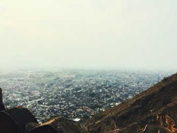 Aerial view of cityscape against clear sky