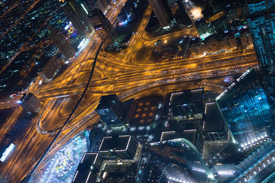 Low angle view of illuminated buildings in city at night