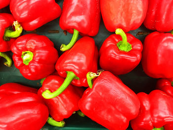 Full frame shot of red bell peppers for sale in market