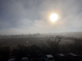 Scenic view of landscape against sky during winter