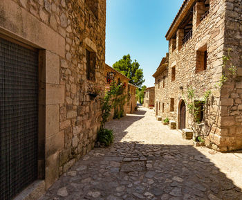 Alley amidst buildings in city