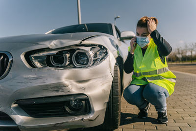 Full length of man standing on car