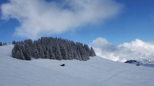 Panoramic view of ski lift against sky