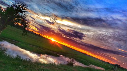 Scenic view of dramatic sky during sunset