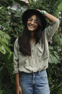 Smiling girl in a botanical garden