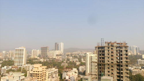 Scenic view of cityscape against sky