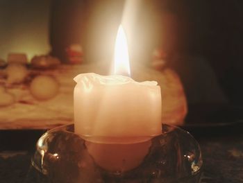 Close-up of tea light candle on table