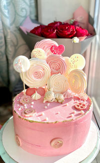 Close-up of cake with pink roses