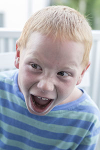 Close-up of boy with mouth open