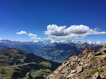 Scenic view of mountain range against blue sky