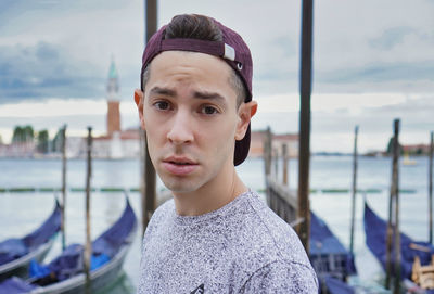 Portrait of young man against sea