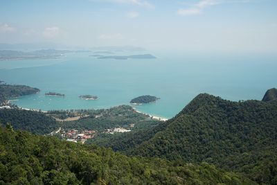 High angle view of sea and mountains against sky at langkawi island