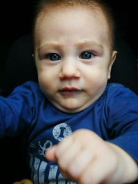 Portrait of cute baby boy at home