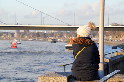 Rear view of woman on boat in sea