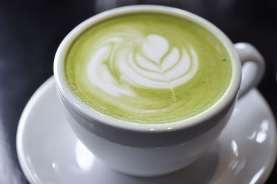 High angle view of coffee cup on table