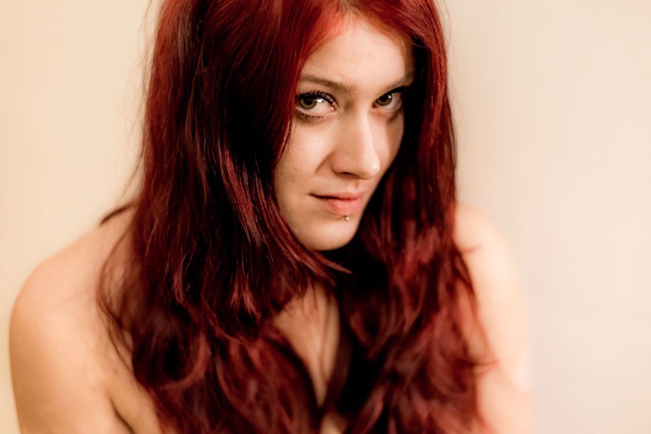 redhead, one person, long hair, studio shot, headshot, portrait, front view, young adult, red, beautiful woman, looking at camera, lifestyles, real people, dyed hair, close-up, white background, young women, indoors, day, adult, people