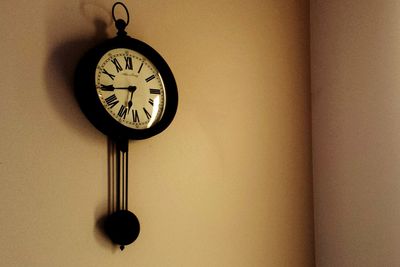 Close-up of clock at home