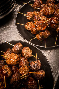 High angle view of meat on barbecue grill