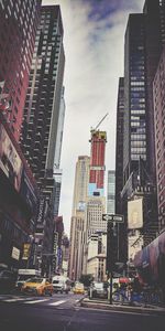 City street amidst buildings against sky