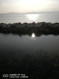 Scenic view of sea against sky at sunset