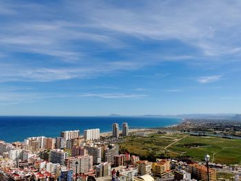 Panoramic view of buildings and sea against sky