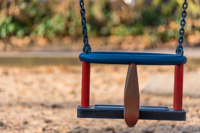 Close-up of swing in playground