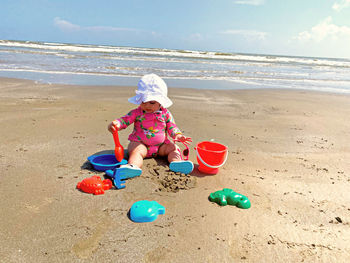 Boy sitting on beach