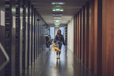 Young woman walking indoors