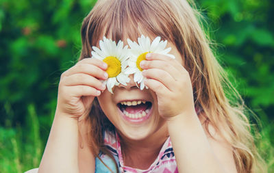 Young woman holding flower