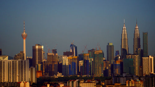 Modern buildings in city against sky