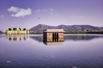 Jal mahal water palace before cloudy sky in jaipur rajasthan