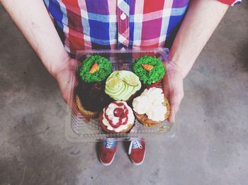 High angle view of man holding food