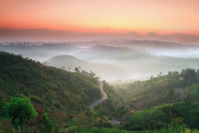 Scenic view of mountains against sky during sunset