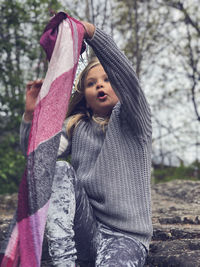 Full length of girl with arms raised 