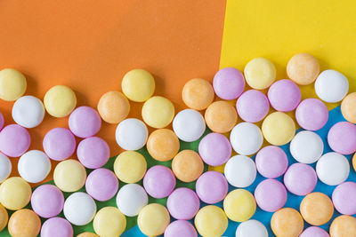 Candy on the colorful background, high angle view, circle candies