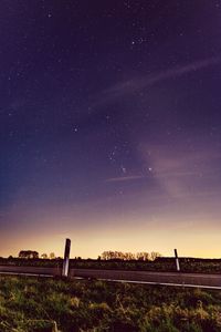 Silhouette of trees on field at night