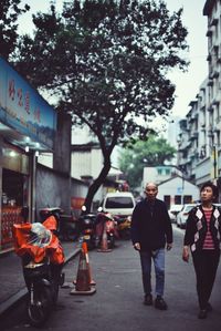 Woman standing on city street