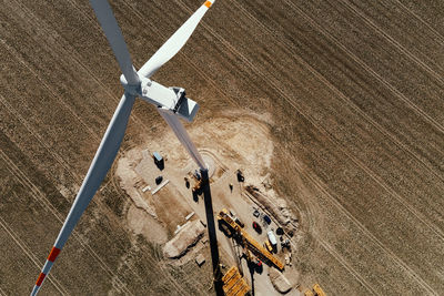 Construction site near windmill turbine, wind generator installing