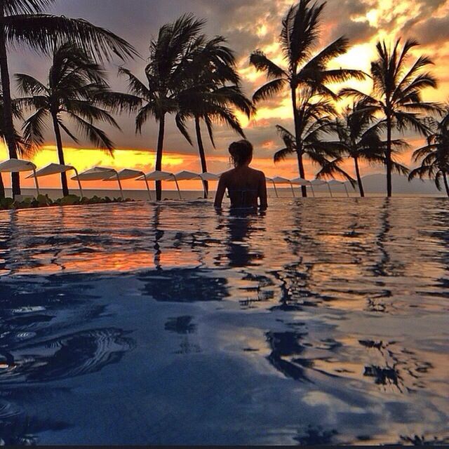 sunset, water, palm tree, lifestyles, leisure activity, sea, sky, reflection, silhouette, men, tree, orange color, full length, beach, person, walking, waterfront